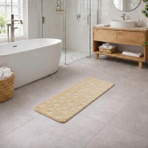 Cream long bathroom runner placed between bathtub and vanity in a modern bathroom with light tile floor and natural daylight, soft plush comfort along the entire length