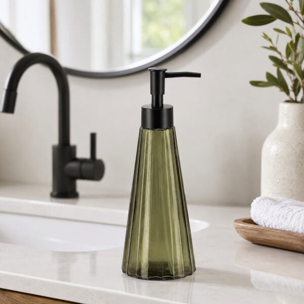 Olive green glass soap dispenser styled on a modern white bathroom vanity with matte black faucet and round mirror
