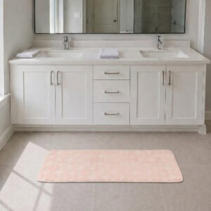 Blush pink long narrow bathroom runner placed in front of a modern double vanity with white shaker cabinetry, fresh and welcoming family bathroom setting