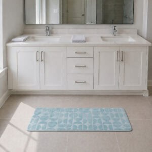 Light blue long narrow bathroom runner placed in front of a modern double vanity with white shaker cabinetry, fresh and welcoming family bathroom setting