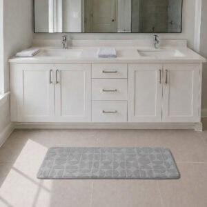 Light gray long narrow bathroom runner placed in front of a modern double vanity with white shaker cabinetry, fresh and welcoming family bathroom setting