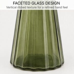 Close-up of the vertical ribbed faceted texture on the olive green glass soap dispenser body and base