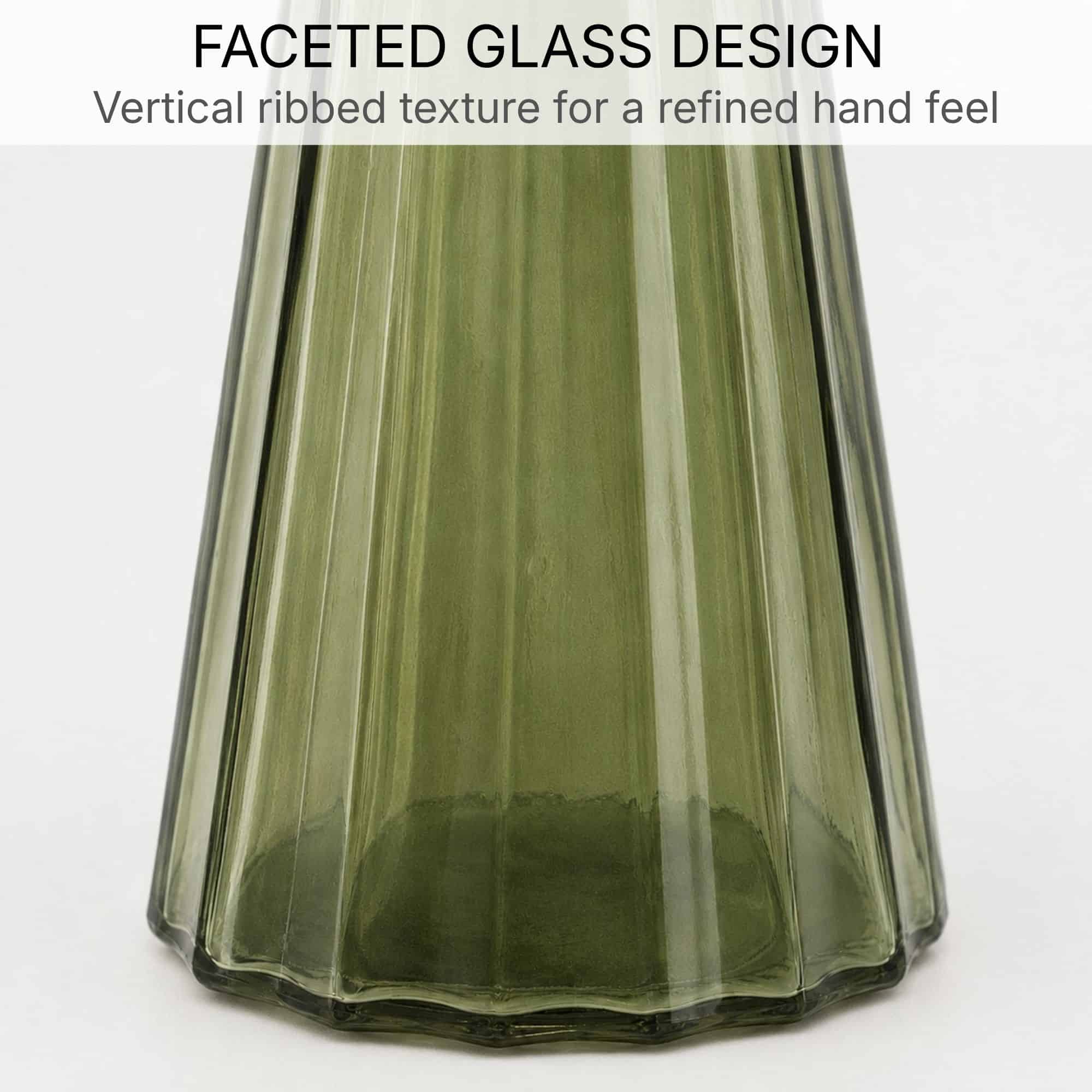 Close-up of the vertical ribbed faceted texture on the olive green glass soap dispenser body and base