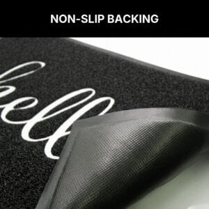 Non-slip rubber backing on hello doormat, textured grip pattern prevents sliding on hard floors, durable PVC construction