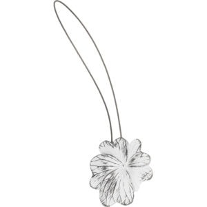 01 (hero packshot): Distressed white and black metal flower curtain tieback with a thin silver cable loop, shown against a plain background to highlight the carved petal detail.