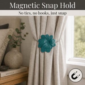 02 (magnetic snap hold): Dark green flower tieback holding a gathered oatmeal linen curtain beside a styled nightstand, its magnetic ends snapping shut with no ties or hooks needed.
