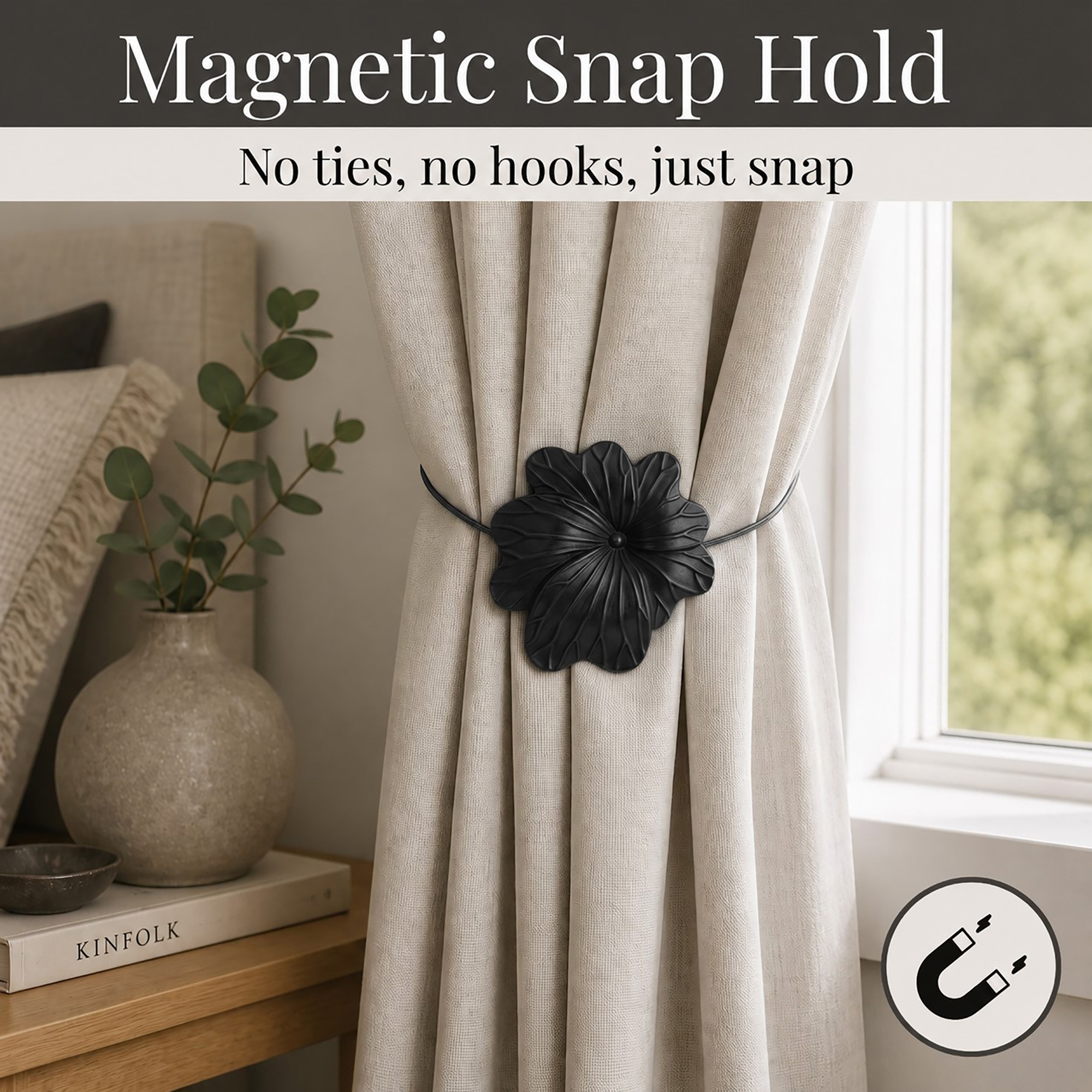 02 (magnetic snap hold): Matte black flower tieback holding a gathered oatmeal linen curtain beside a styled nightstand, its magnetic ends snapping shut with no ties or hooks needed.