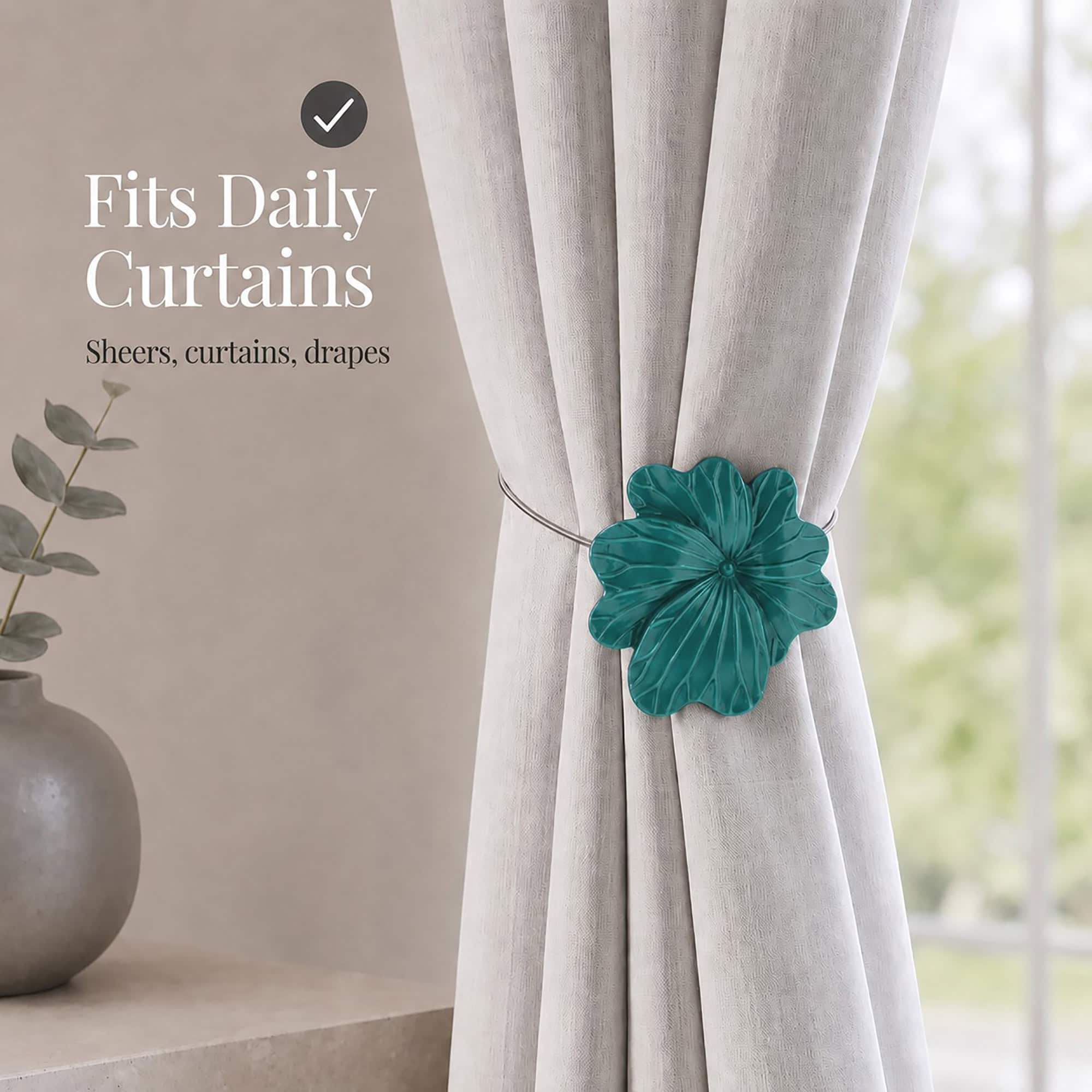 07 (fits daily curtains): Dark green flower tieback gathering a greige linen curtain by a window, suited to everyday sheers, curtains, and drapes in a calm neutral setting.