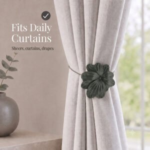 07 (fits daily curtains): Khaki flower tieback gathering a greige linen curtain by a window, suited to everyday sheers, curtains, and drapes in a calm neutral setting.