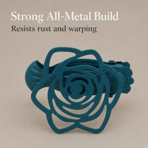 Teal blue flower curtain holdback clip placed on a neutral background, highlighting its sturdy design. Text overlay reads "Strong All-Metal Build, Resists rust and warping".